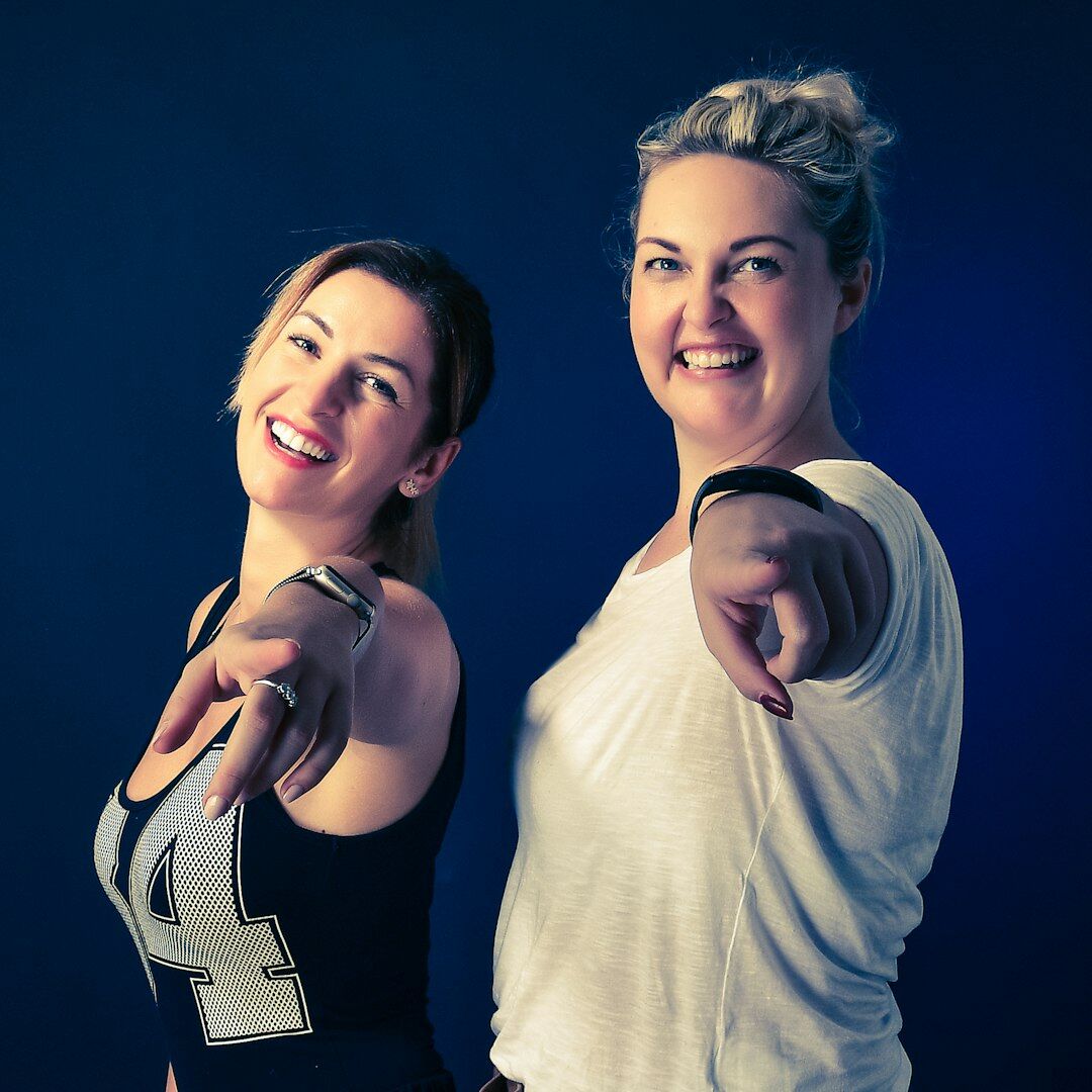 Female camera operator and course instructor smiling