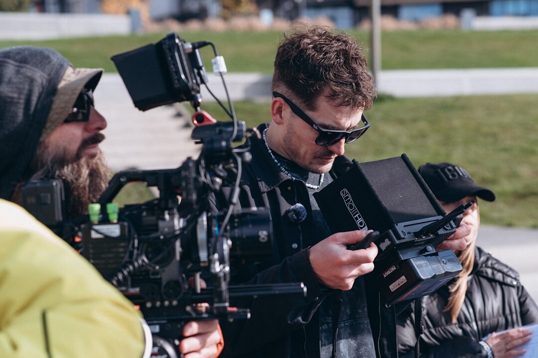 Camera crew working together on a film set with professional equipment